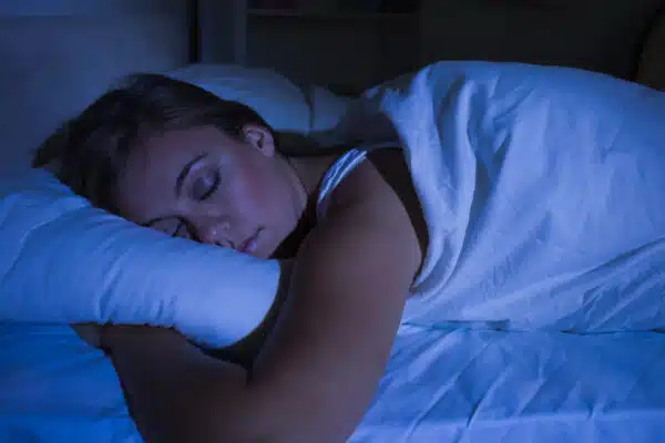 woman sleeping - best sleep hacks